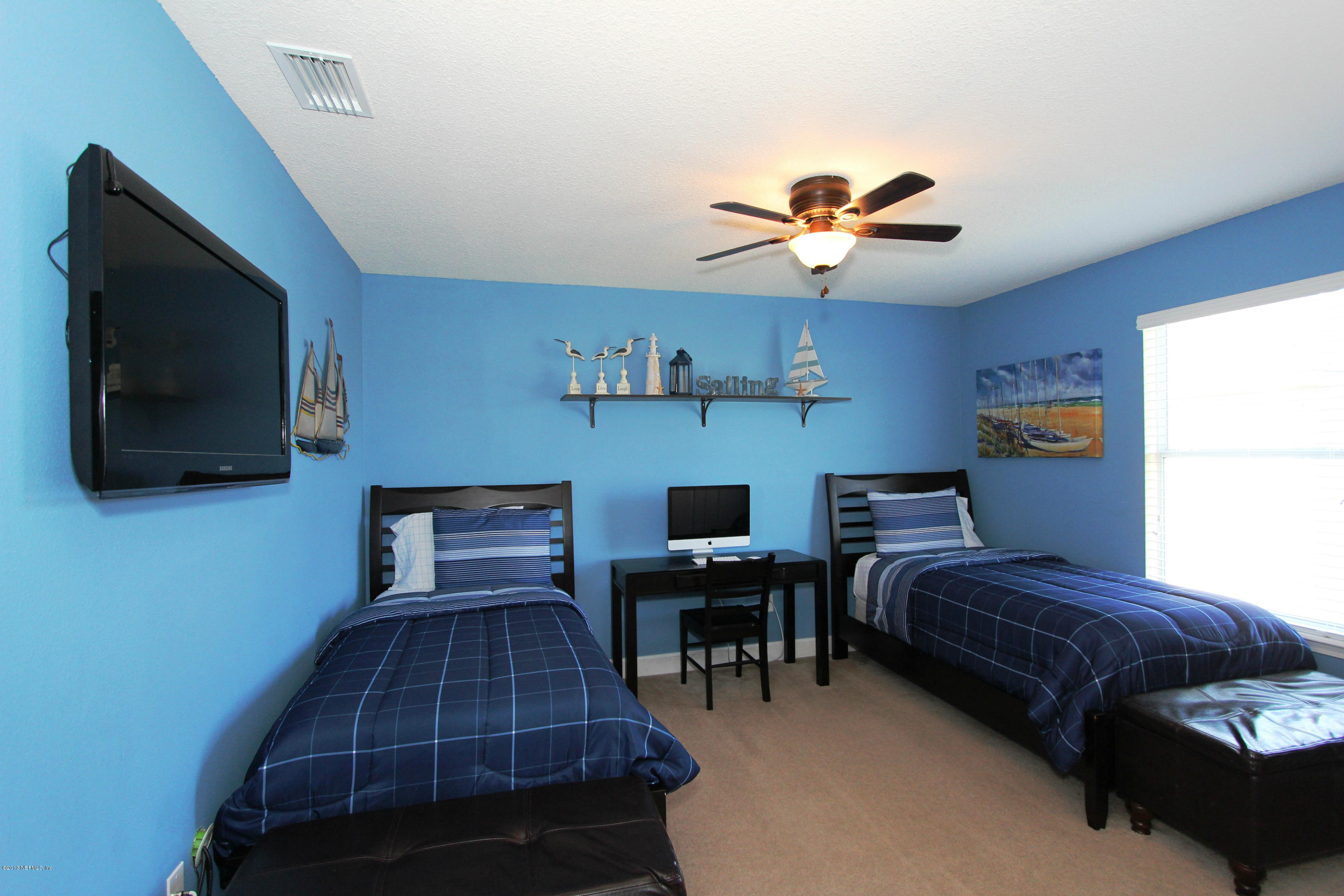 732 Castledale Court Jacksonville, FL 32259 - Photo 41 of 50 a bedroom with furniture and a flat screen tv