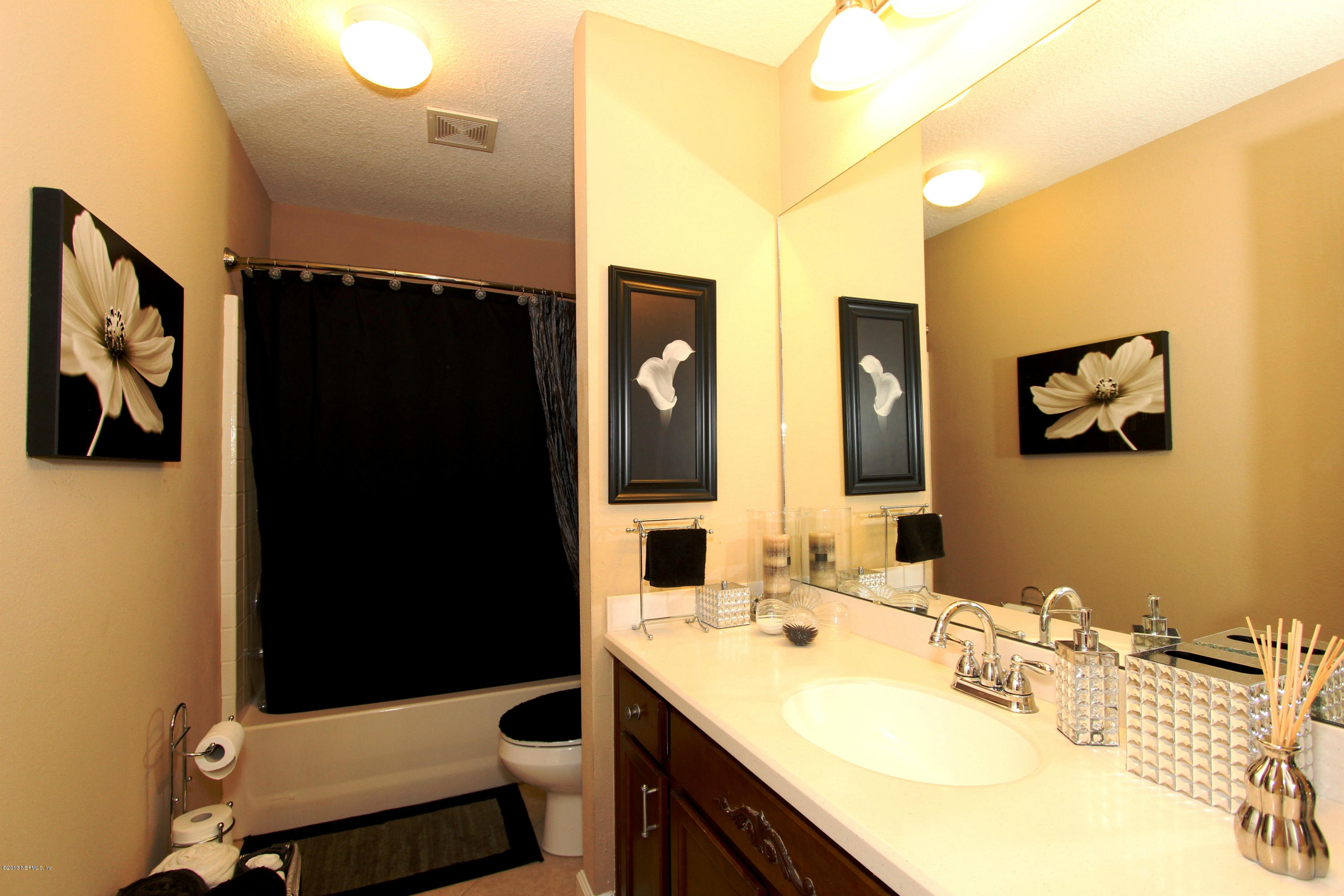 732 Castledale Court Jacksonville, FL 32259 - Photo 42 of 50 a bathroom with a sink vanity granite and a mirror