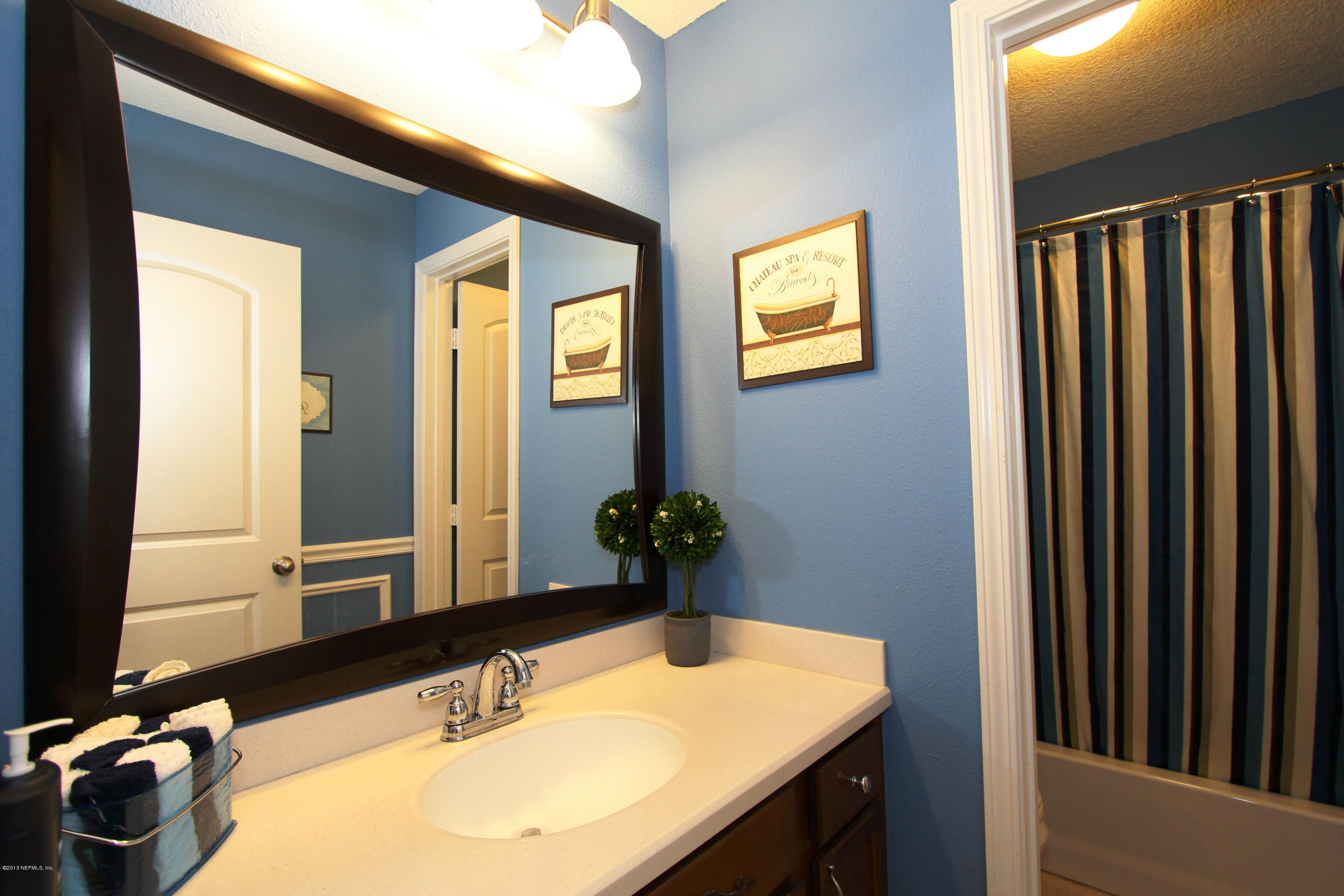 732 Castledale Court Jacksonville, FL 32259 - Photo 43 of 50 a bathroom with a sink and a mirror