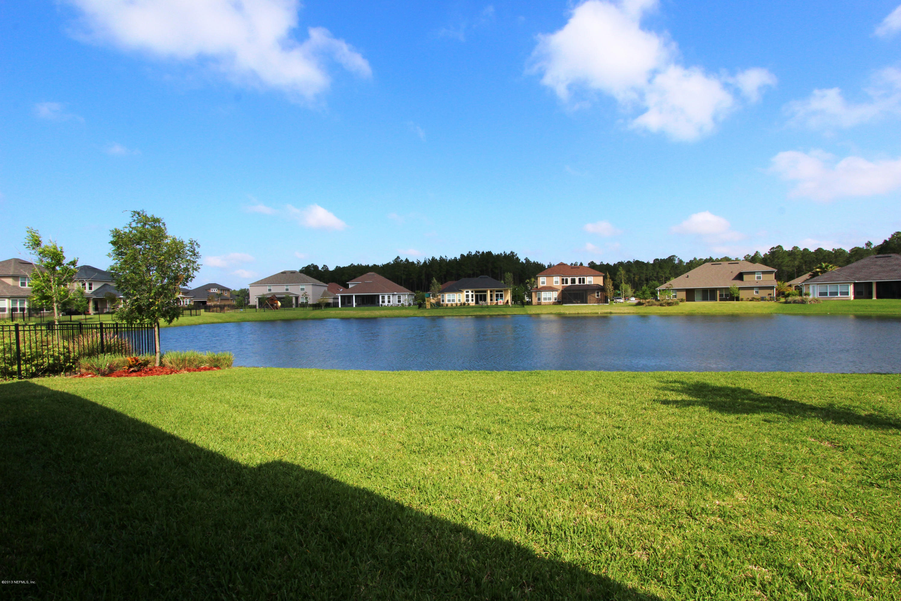 732 Castledale Court Jacksonville, FL 32259 - Photo 47 of 50 a view of a city with swimming pool and mountains in the background