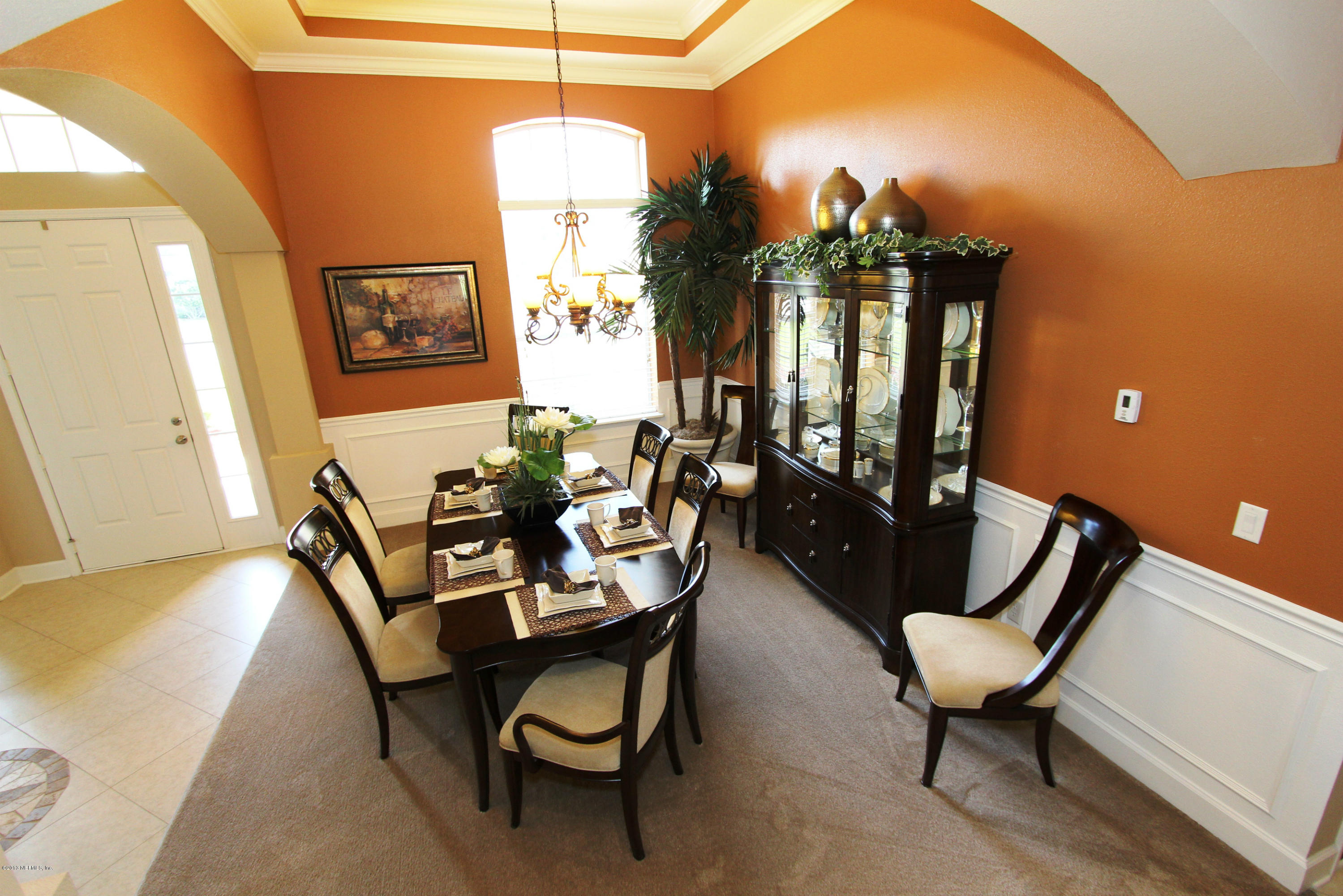 732 Castledale Court Jacksonville, FL 32259 - Photo 10 of 50 a view of a dining room with furniture and a chandelier