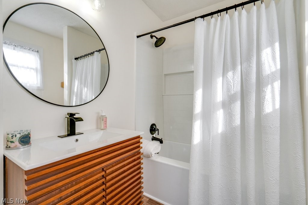12 South 4th Street Rittman, OH 44270 - Photo 26 of 48 Bathroom with vanity and shower / tub combo with curtain