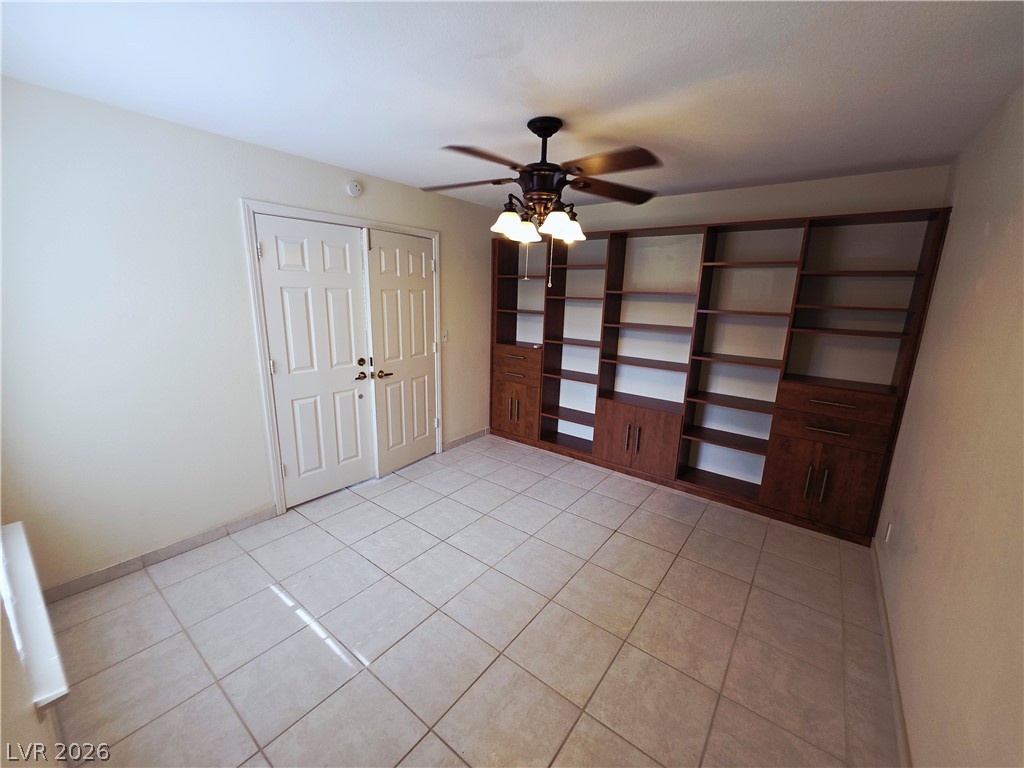 2920 Setting Sun Street Las Vegas, NV 89117 - Photo 36 of 43 This versatile room features expansive built-in shelving, offering endless possibilities for organization.