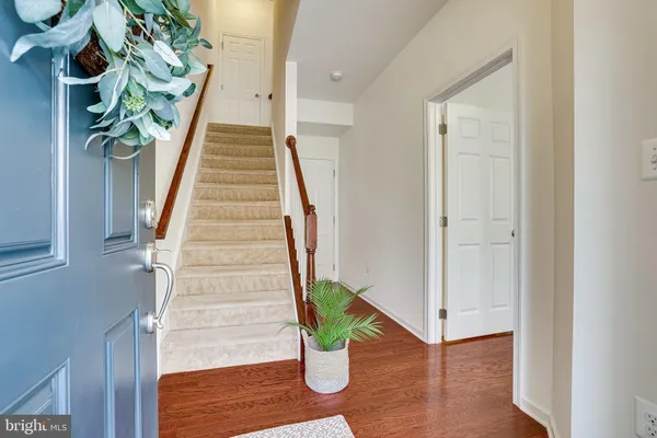 a view of entryway with wooden floor