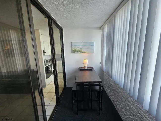 a view of a room with furniture and windows