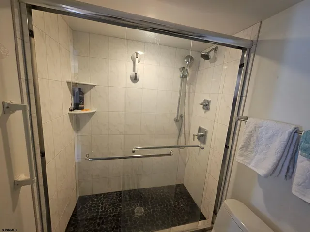 a bedroom with bed and window