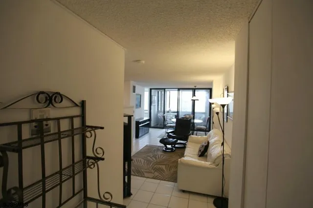 a living room with furniture and a walk in closet