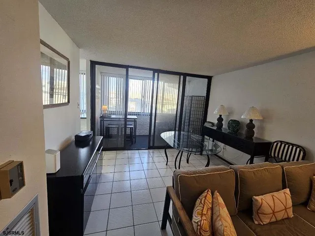 a kitchen with a refrigerator a stove top oven and cabinets