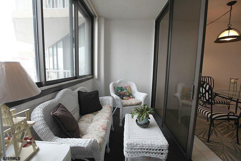 111 South 16th Avenue, Unit 312 Longport, NJ 08403 - Photo 6 of 14 a bedroom with furniture and a balcony