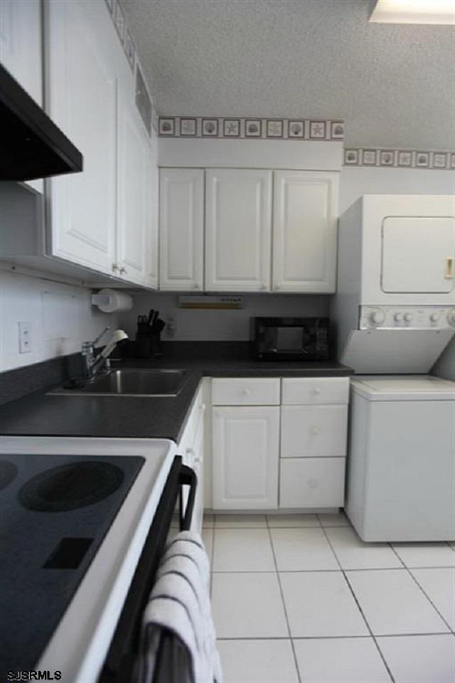 111 South 16th Avenue, Unit 312 Longport, NJ 08403 - Photo 9 of 14 a kitchen with cabinets and appliances