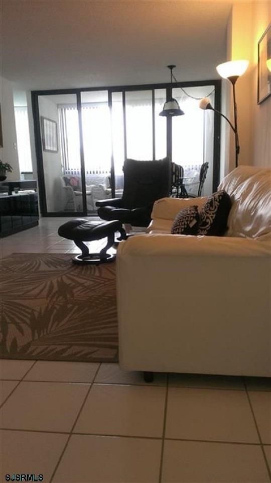 111 South 16th Avenue, Unit 312 Longport, NJ 08403 - Photo 10 of 14 a living room with furniture and a flat screen tv