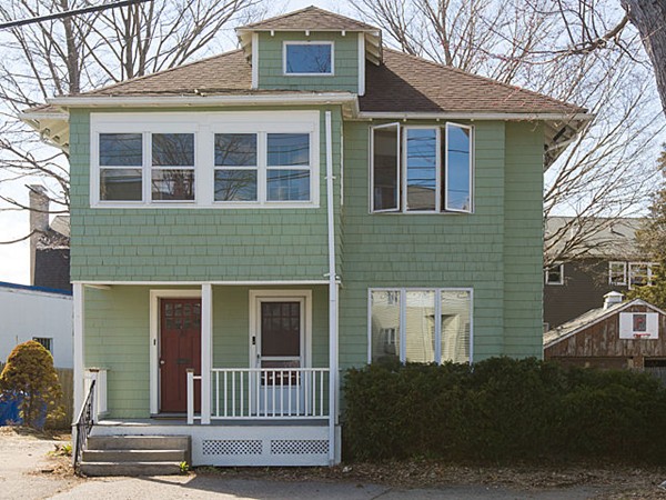253 Sycamore Street, Unit 253 Watertown, MA 02472 - Photo 1 of 16 a front view of a house with a yard
