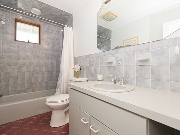 253 Sycamore Street, Unit 253 Watertown, MA 02472 - Photo 11 of 16 a bathroom with a sink a toilet and shower
