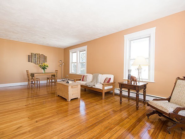 253 Sycamore Street, Unit 253 Watertown, MA 02472 - Photo 3 of 16 a living room with furniture and a wooden floor