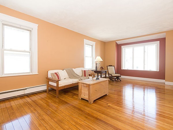 253 Sycamore Street, Unit 253 Watertown, MA 02472 - Photo 5 of 16 a living room with furniture and a wooden floor