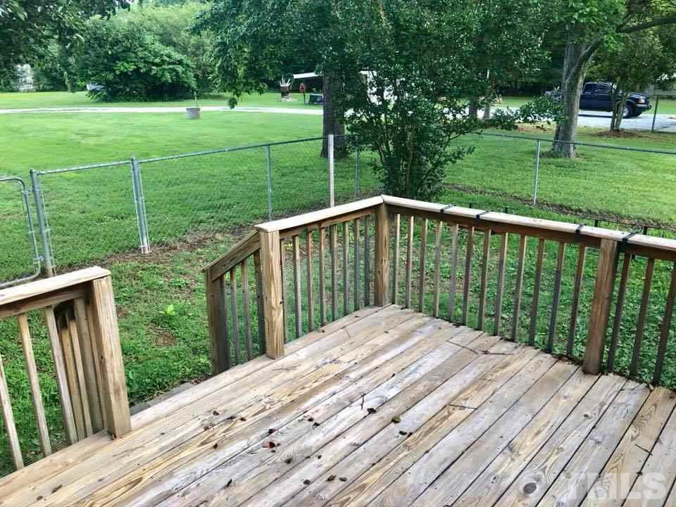 2604 Burlington Road Roxboro, NC 27574 - Photo 15 of 17 a balcony with trees in front of it