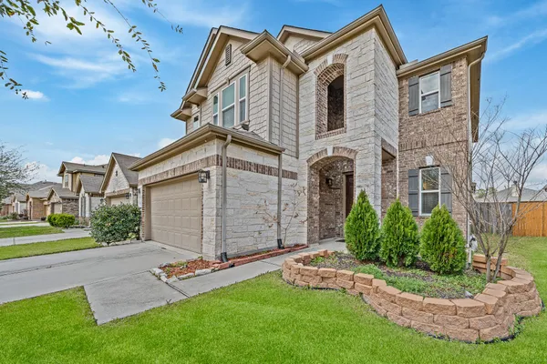 a view of a front of a house with a yard