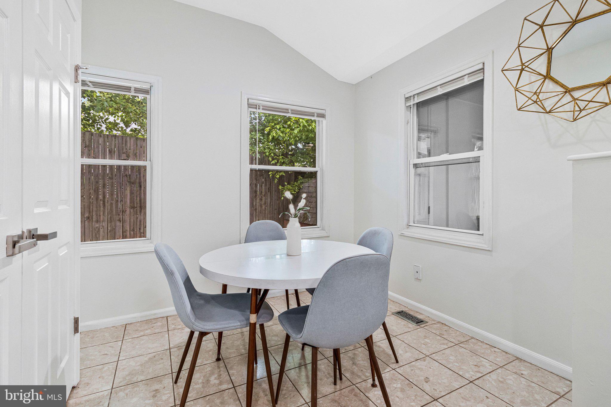 11515 Goodloe Road Silver Spring, MD 20906 - Photo 14 of 33 a view of a dining room with furniture and window