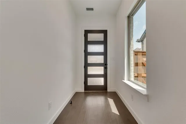 a view of an empty room and window