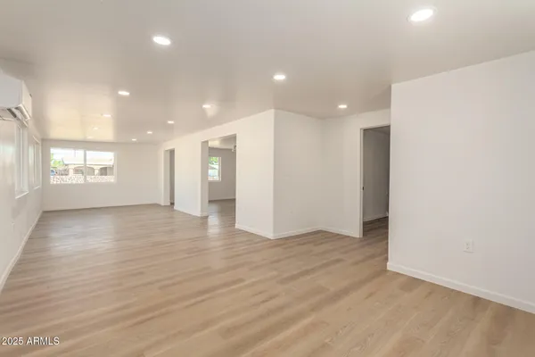 a kitchen with stainless steel appliances a refrigerator and a stove top oven