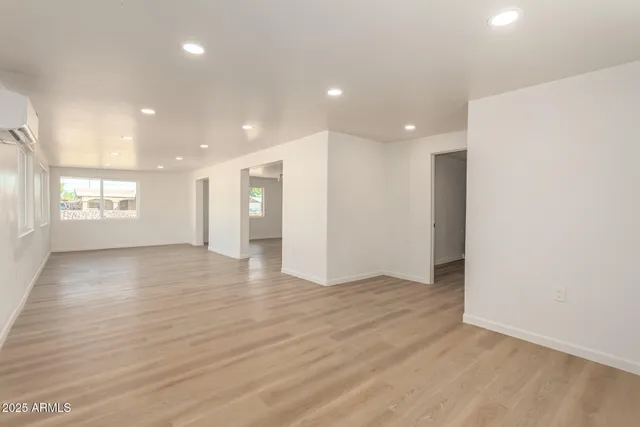a kitchen with stainless steel appliances a refrigerator and a stove top oven
