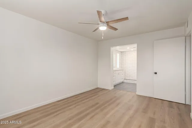 a bathroom with a shower sink and mirror