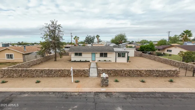a aerial view of a house with a yard