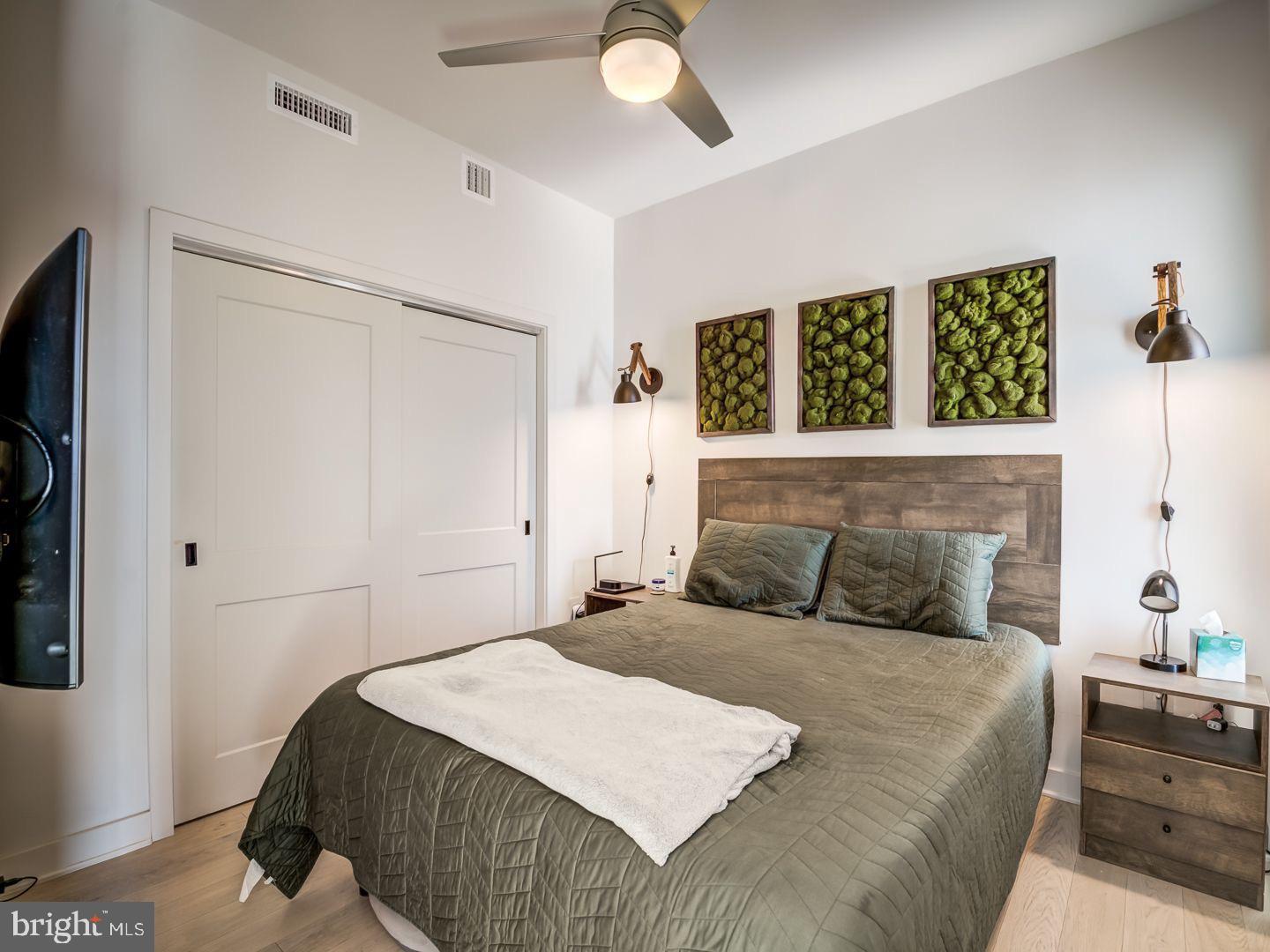 70 N Street Southeast, Unit N811 Washington, DC 20003 - Photo 11 of 28 a bedroom with a large bed and a chandelier
