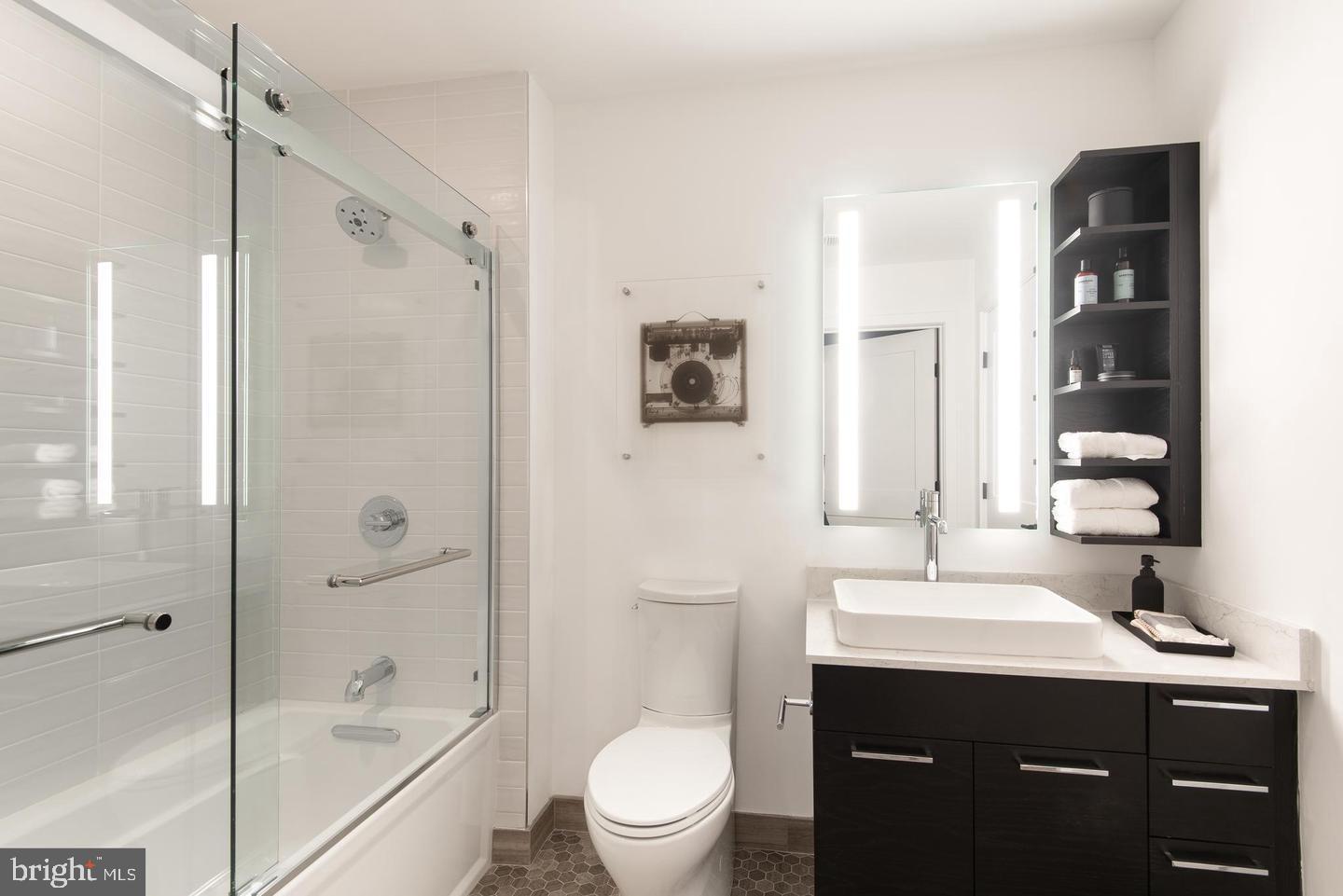 70 N Street Southeast, Unit N811 Washington, DC 20003 - Photo 17 of 28 a bathroom with a sink a toilet and shower