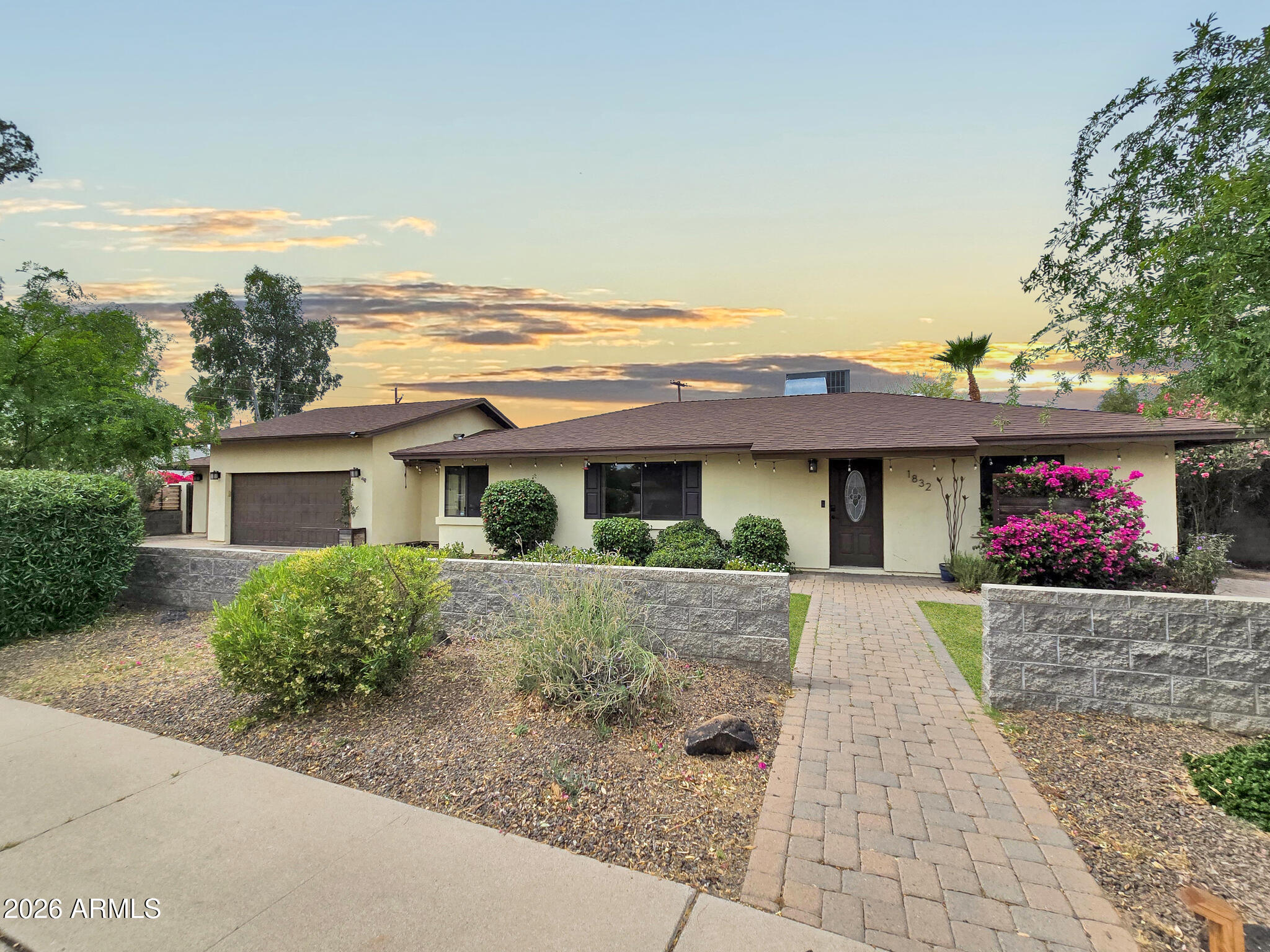 front view of a house with a yard