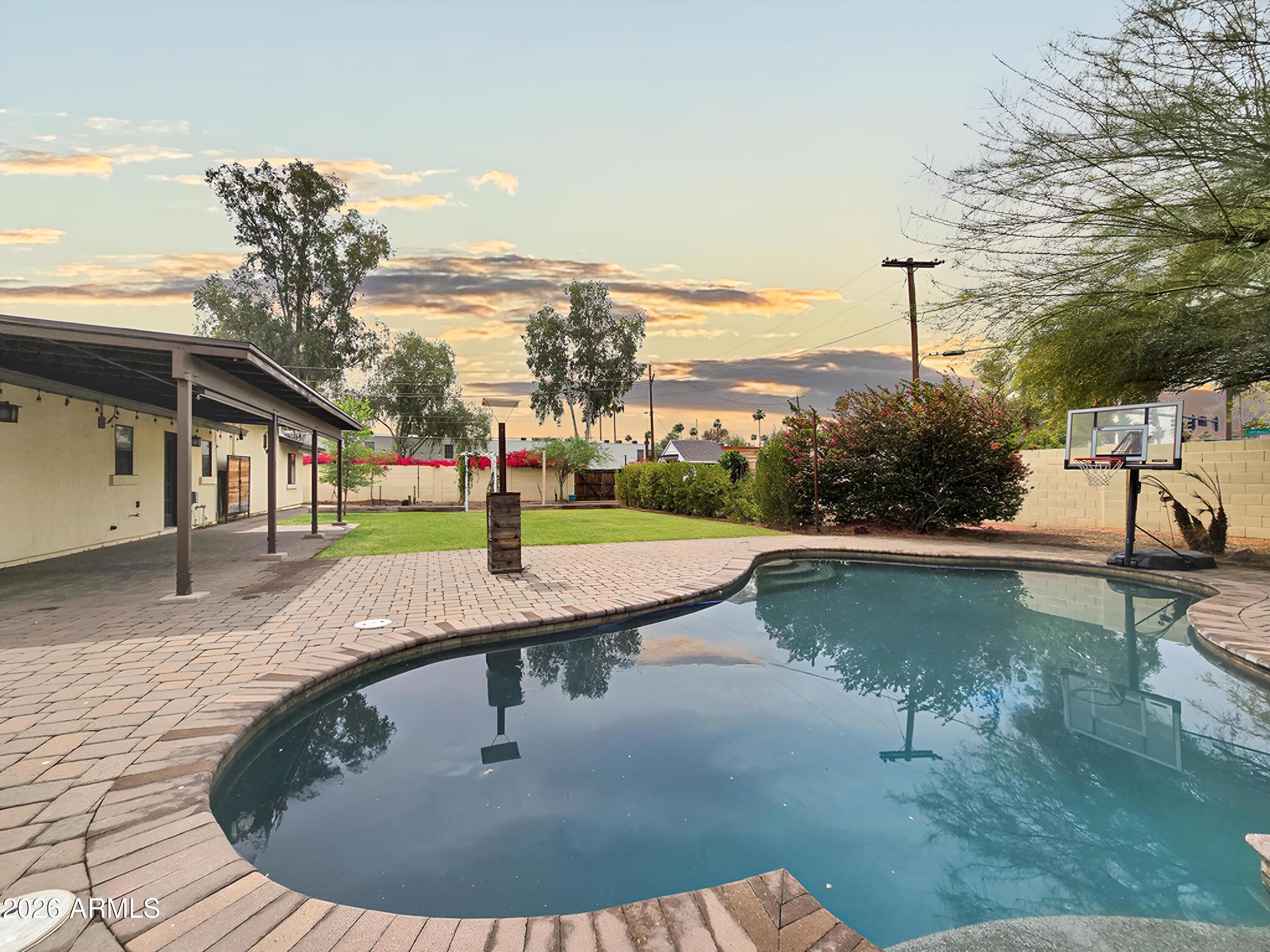 1832 West Northview Avenue Phoenix, AZ 85021 - Photo 4 of 17 a view of a swimming pool with a yard and sitting space