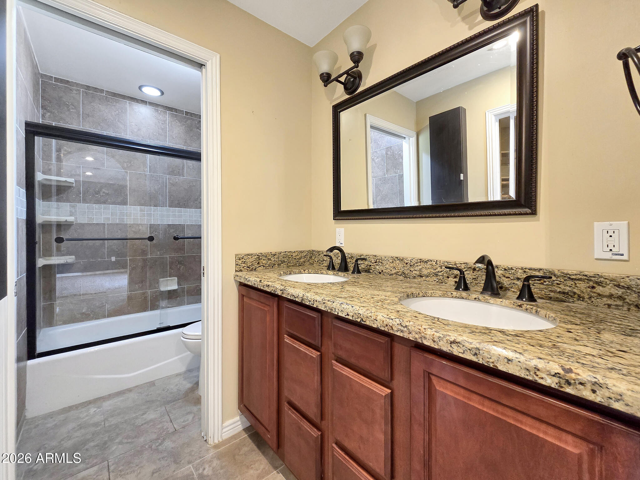 1832 West Northview Avenue Phoenix, AZ 85021 - Photo 6 of 17 a bathroom with a granite countertop sink two mirror and a shower