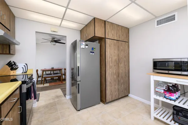 a view of a livingroom with workspace and a window