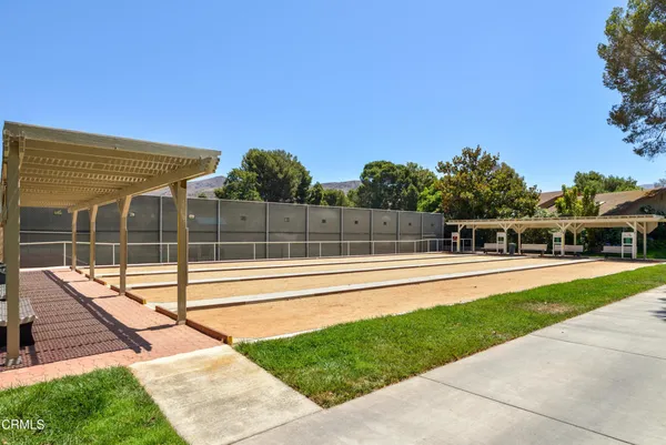 a view of a swimming pool with a yard