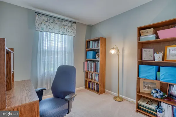 a workspace with furniture and a window