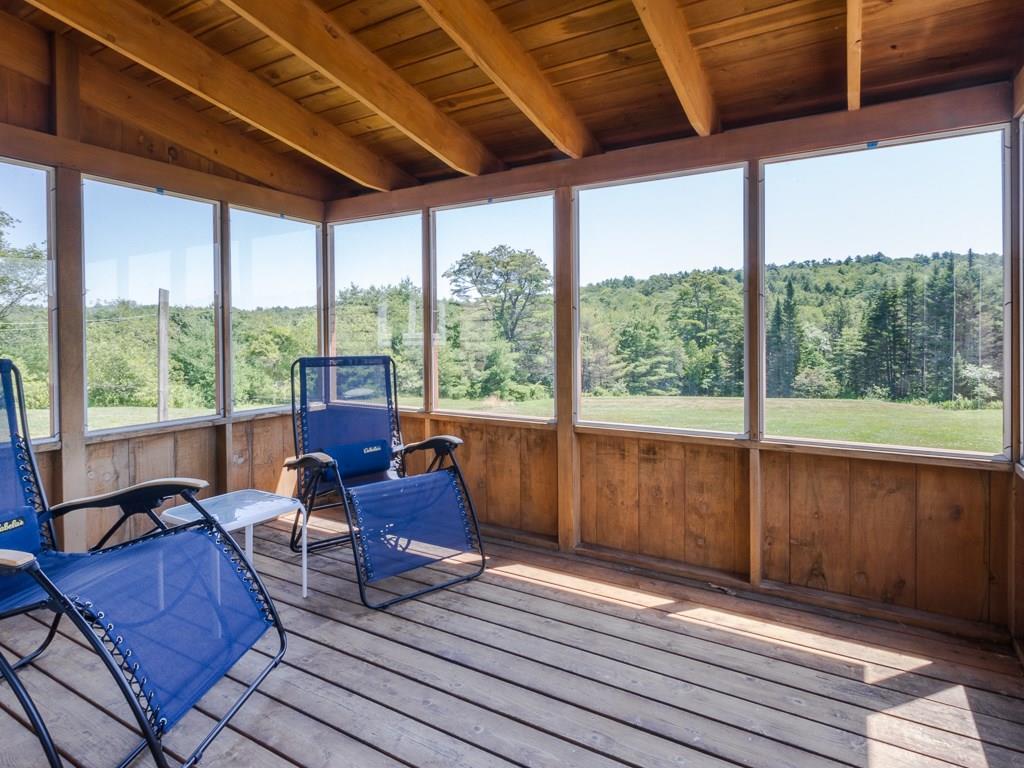 312 Lynch Road Newcastle, ME 04553 - Photo 7 of 20 Sunroom overlooks vast sunny backyard.