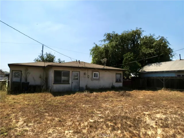 a view of a lake with a house in the background