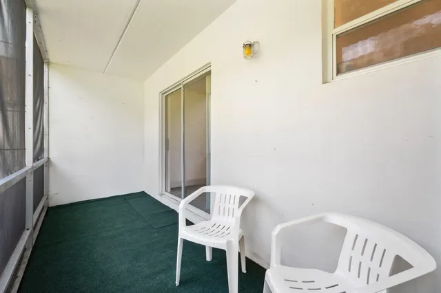 a view of a room with a table and chair