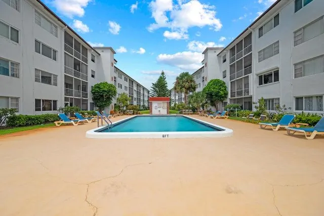 a view of pool with outdoor seating