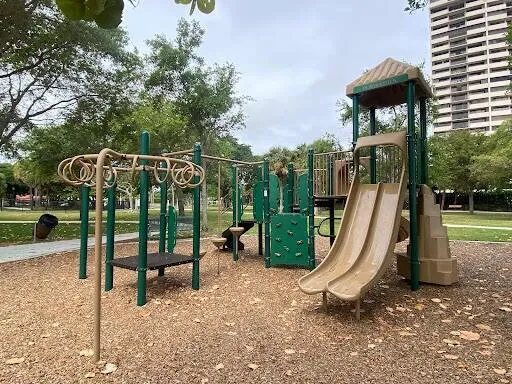 a view of a park that has a sign on it