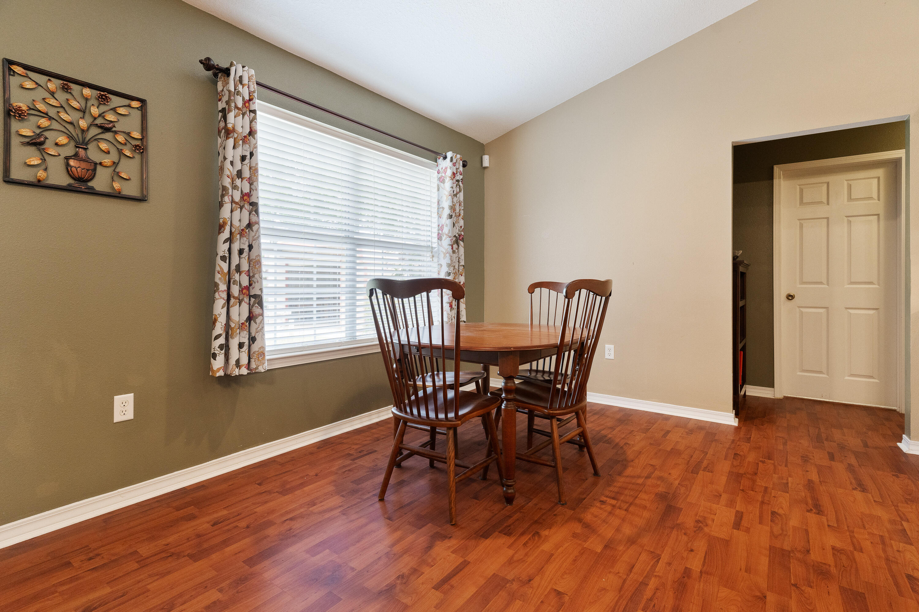 6100 Buckward Road Baker, FL 32531 - Photo 30 of 55 a view of a dining room with furniture and wooden floor