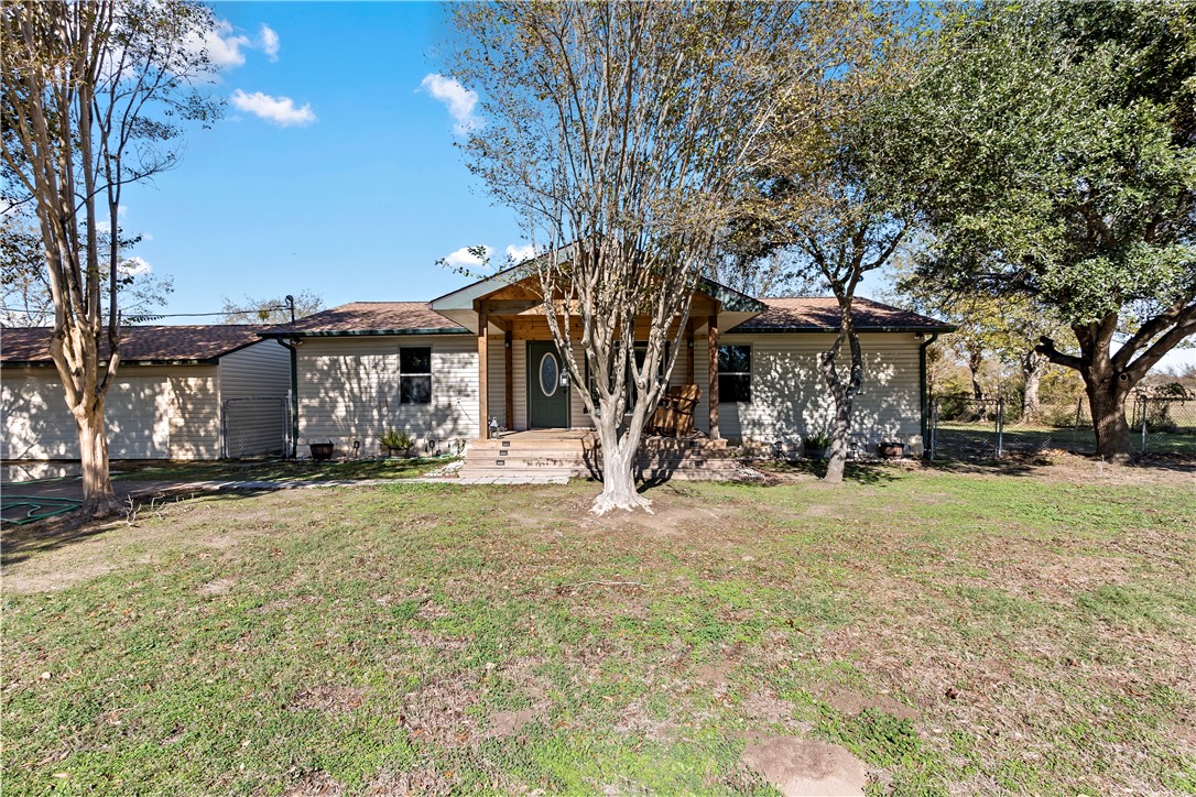 8801 Old Reliance Road Bryan, TX 77808 - Photo 1 of 24 Charming home tucked among mature trees and open green space.