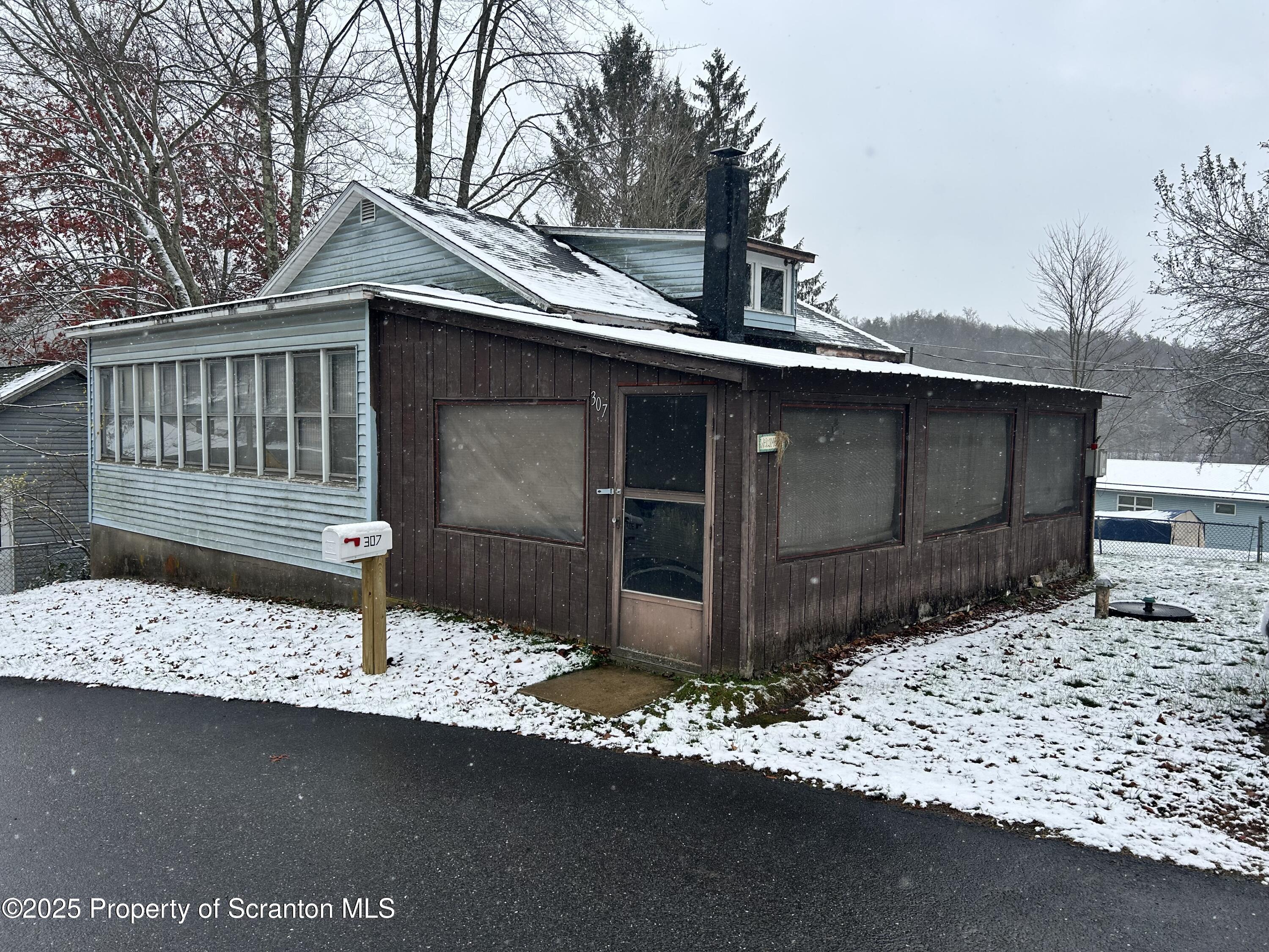 307 Valley Lane Nicholson, PA 18446 - Photo 1 of 16 a front view of a house with a garage