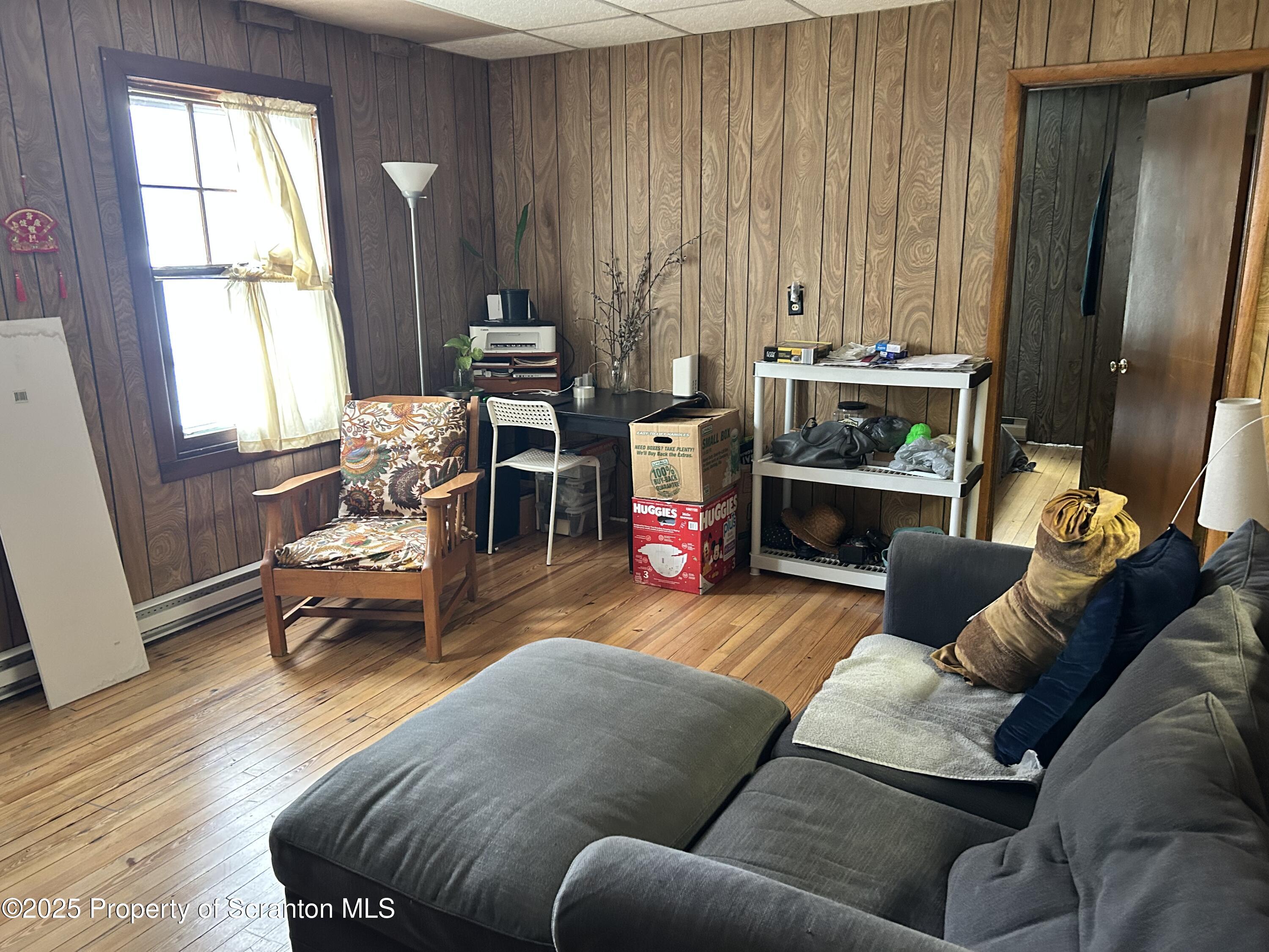 307 Valley Lane Nicholson, PA 18446 - Photo 13 of 16 a living room with furniture and a wooden floor