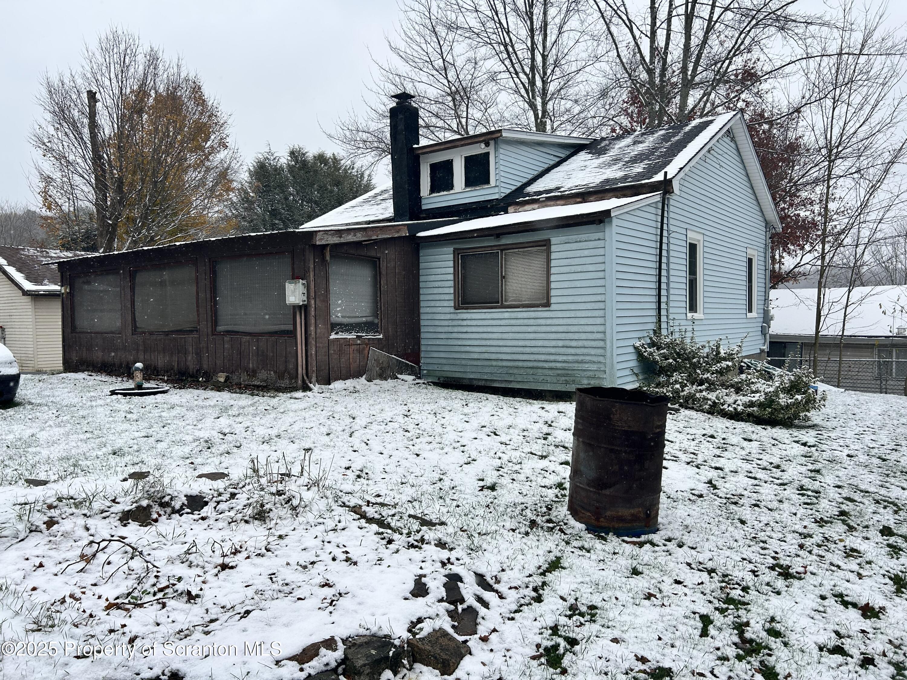 307 Valley Lane Nicholson, PA 18446 - Photo 2 of 16 a front view of a house with a yard and garage