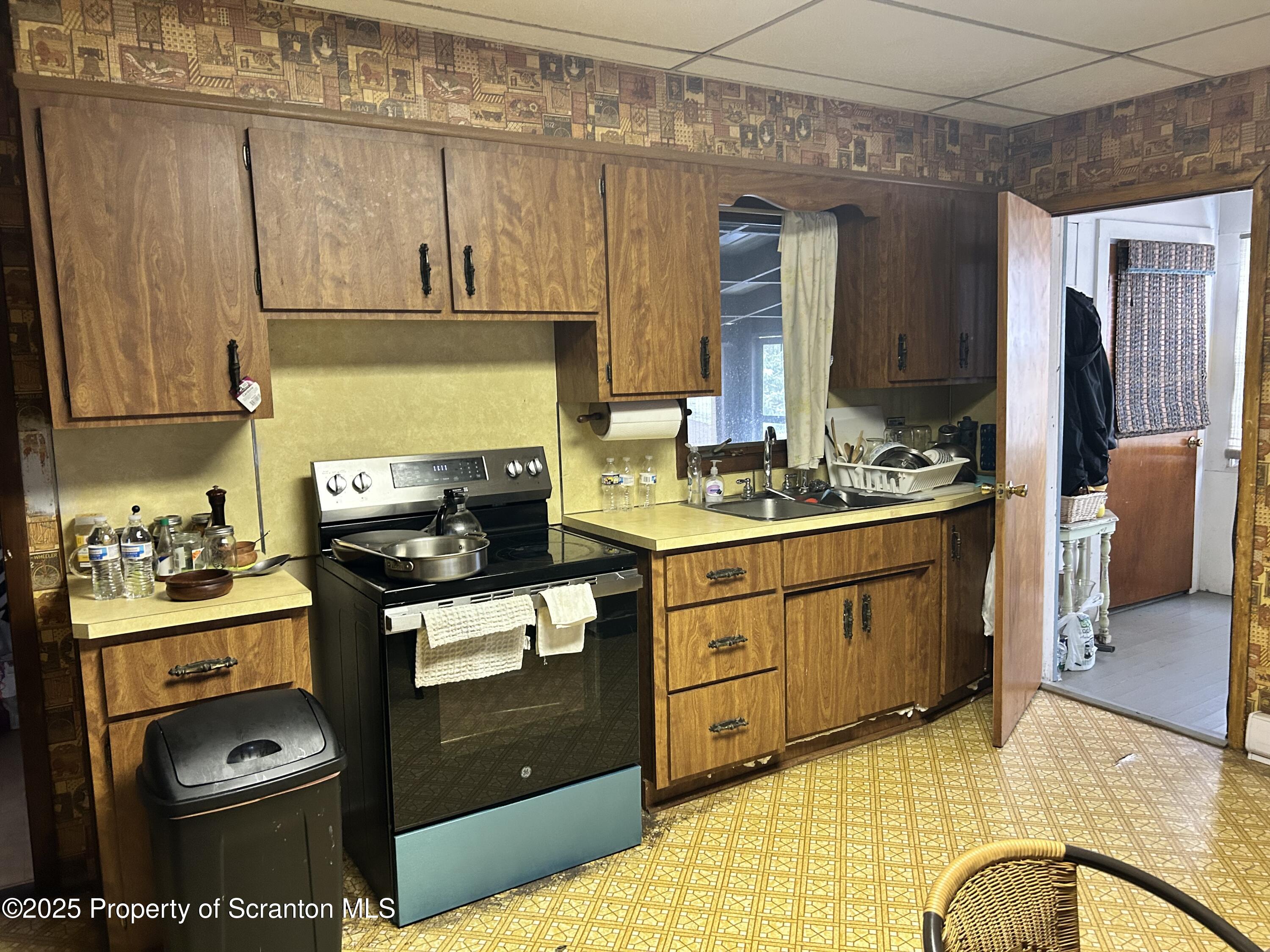 307 Valley Lane Nicholson, PA 18446 - Photo 8 of 16 a kitchen with stainless steel appliances granite countertop a stove a sink and a microwave