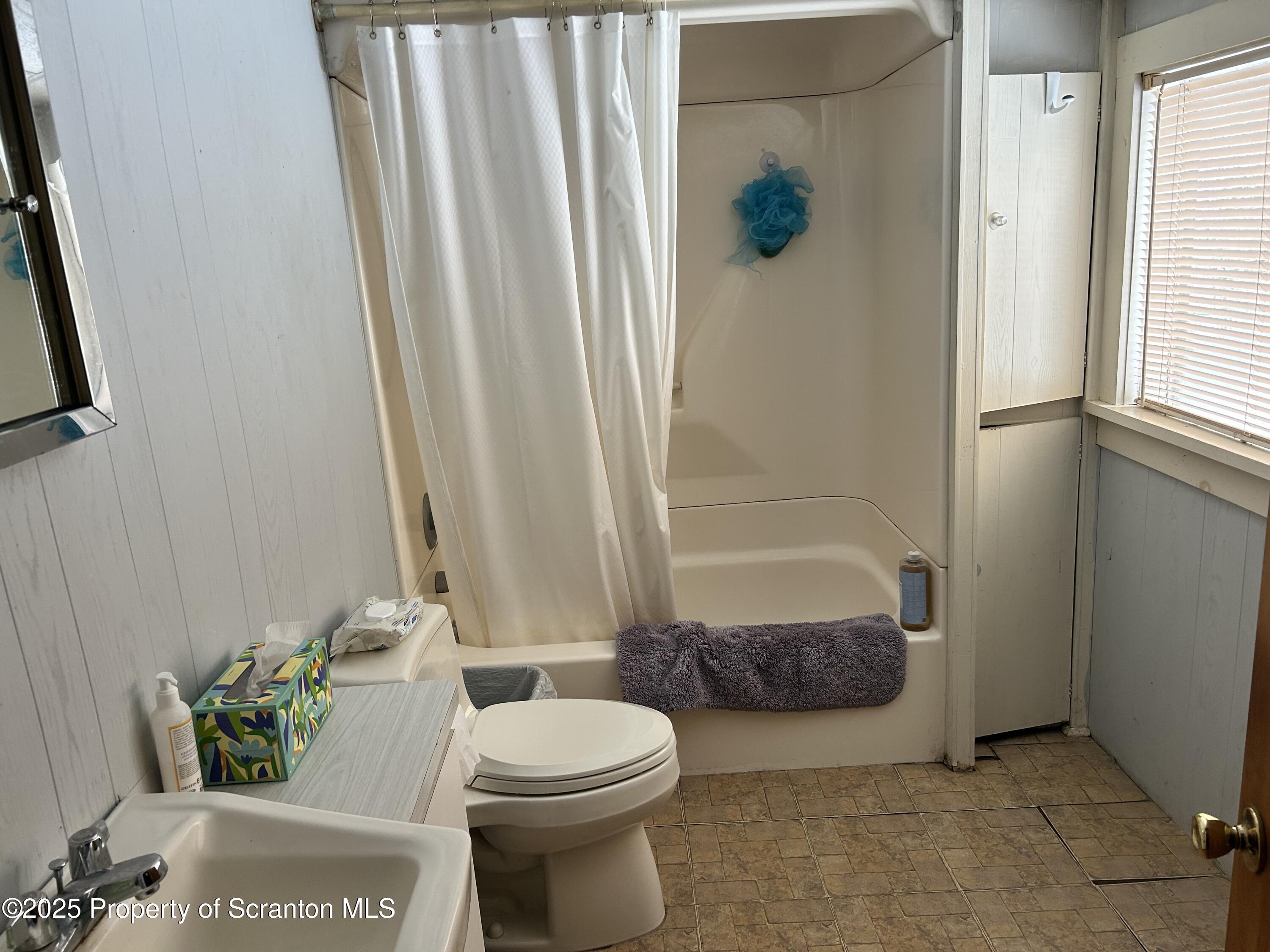 307 Valley Lane Nicholson, PA 18446 - Photo 10 of 16 a bathroom with a toilet and shower