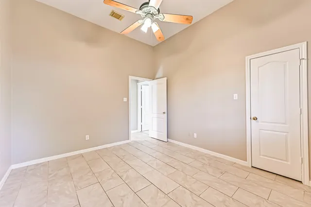a bathroom with a double vanity sink a mirror and a bathtub