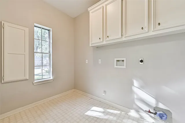 a view of a patio with table and chairs and wooden fence