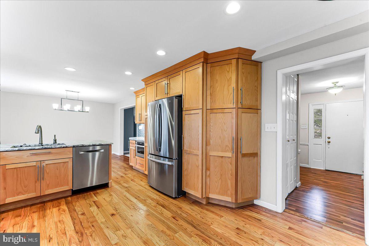 720 Brainerd Road Exton, PA 19341 - Photo 12 of 62 a kitchen with stainless steel appliances a refrigerator and wooden floor